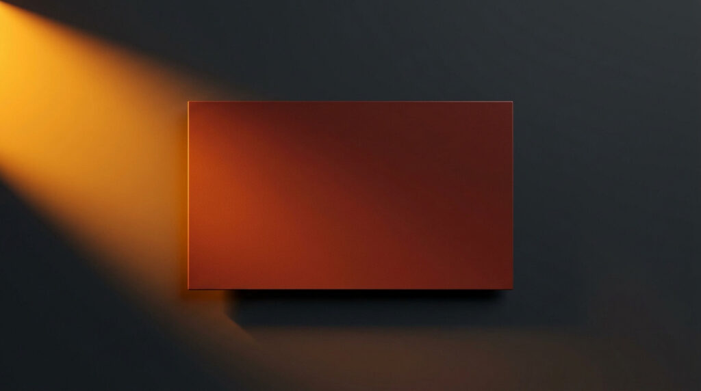 Rectangle de couleur RAL 8012 Brun rouge éclairé par un faisceau de lumière chaude sur fond gris sombre.